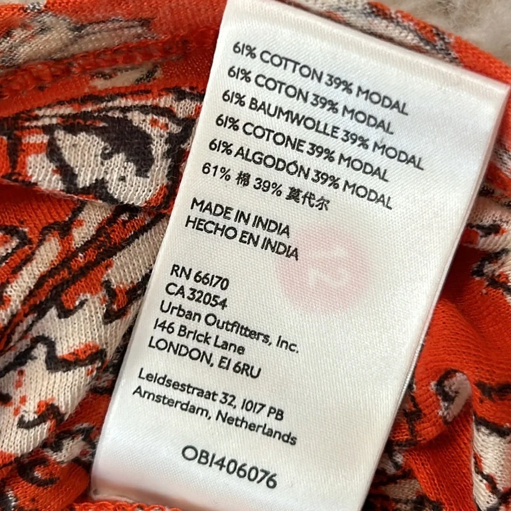 NWT FREE PEOPLE M Say the Word top with balloon sleeves in funky V neck style